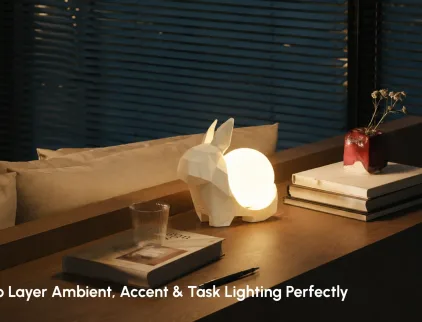 Layered lighting design with ambient accent and task lighting in a modern living space